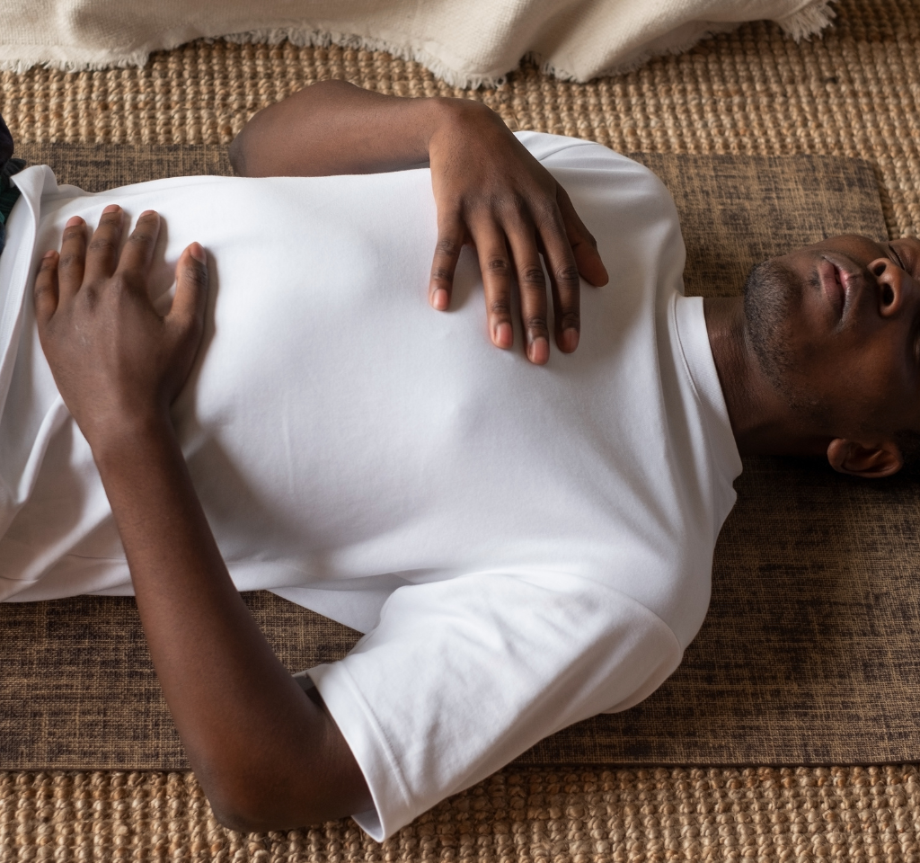 man laying on back breathing